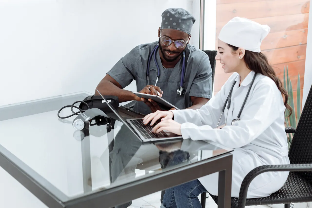 Medical professionals collaborating with digital devices